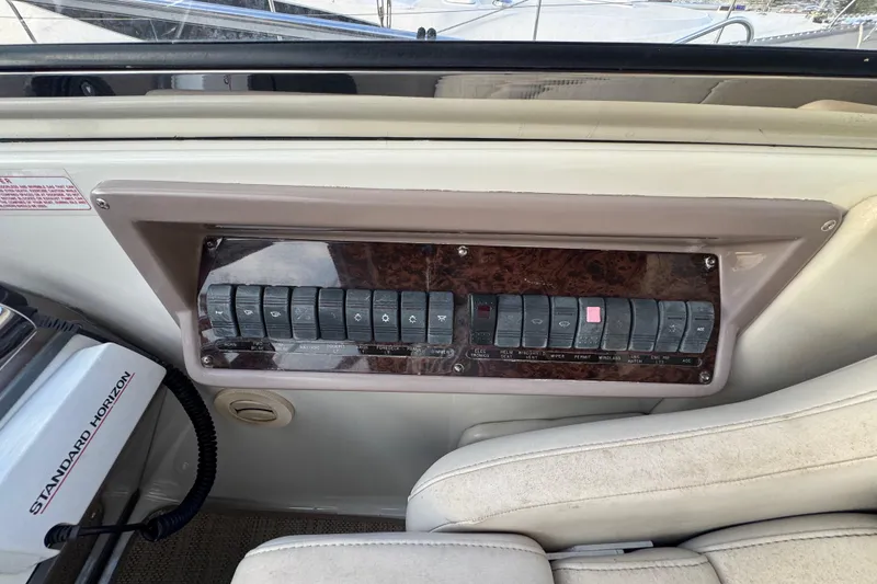 Slide: The Image of Control panel of a 2002 Regal Commodore 3860 boat with labeled switches. - 21