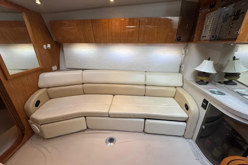 Slide: The Image of Luxurious interior of 2002 Regal Commodore 3860 yacht with cream leather seating and wooden cabinetry. - 30