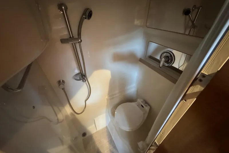 Slide: The Image of Bathroom interior of 2002 Regal Commodore 3860 yacht with shower and toilet. - 36