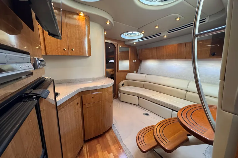 Slide: The Image of Luxurious interior of 2002 Regal Commodore 3860 yacht with wood cabinetry and plush seating. - 37