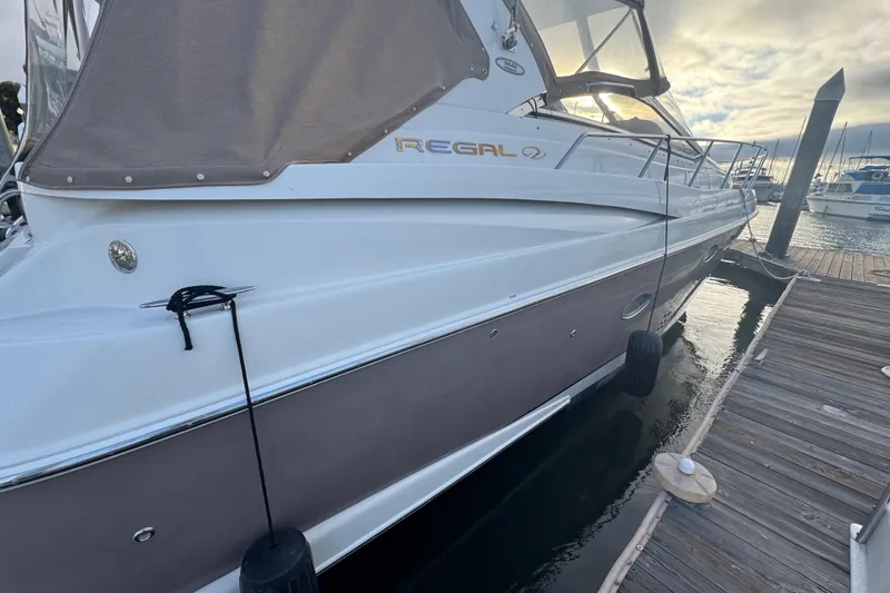 Slide: The Image of 2002 Regal Commodore 3860 yacht docked at marina, side view. - 40