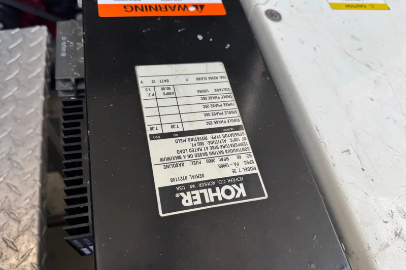 Slide: The Image of Kohler generator label on a 2002 Regal Commodore 3860 boat. - 47