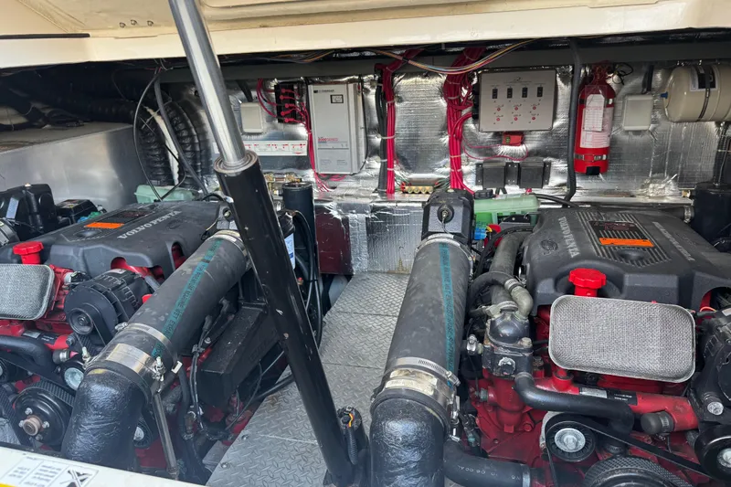 Slide: The Image of Engine room of 2002 Regal Commodore 3860 with dual Volvo Penta engines and electrical systems. - 48