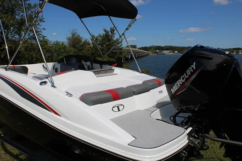Slide: The Image of 2021 Tahoe T16 boat with Mercury engine by a scenic lake. - 9