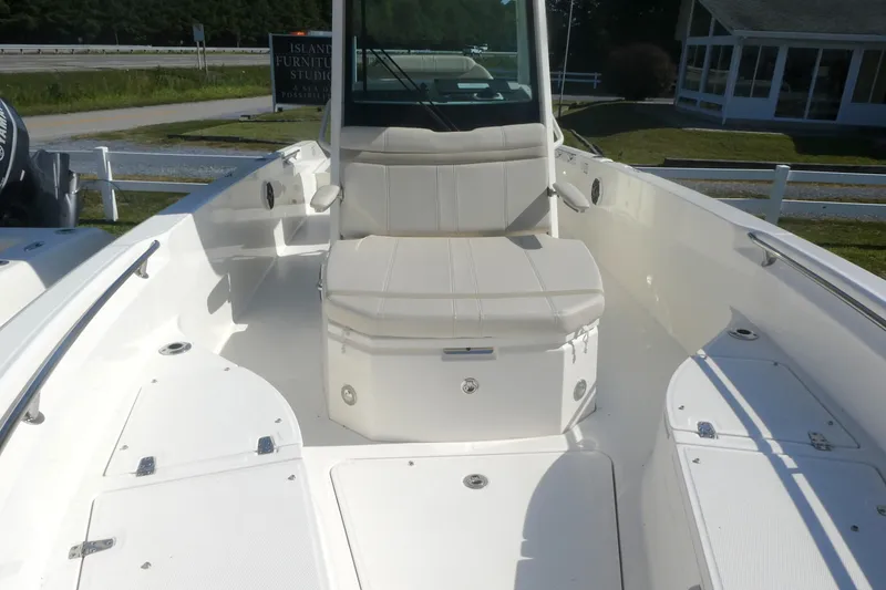 Slide: The Image of 2023 Boston Whaler 280 Dauntless boat interior with seating and storage compartments. - 18