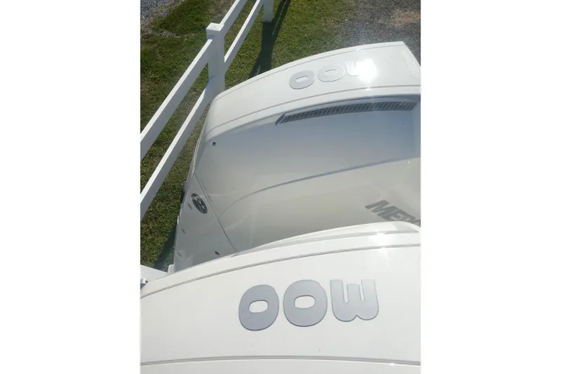 Slide: The Image of 2023 Boston Whaler 280 Dauntless boat engines, white exterior, outdoor display. - 5