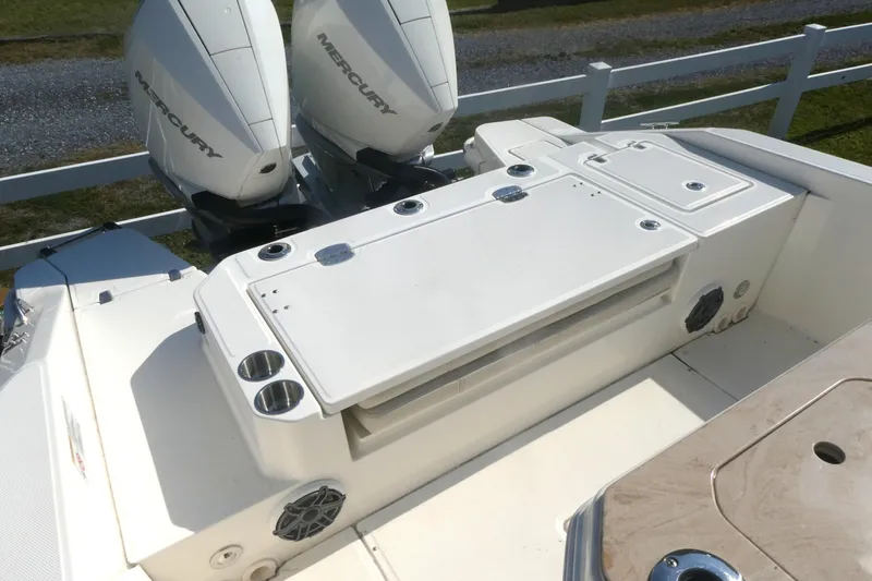 Slide: The Image of 2023 Boston Whaler 280 Dauntless boat with dual Mercury engines and deck features. - 7