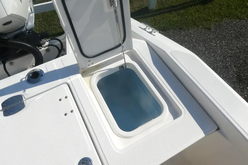 Slide: The Image of 2023 Boston Whaler 280 Dauntless boat with open storage compartment on deck. - 9