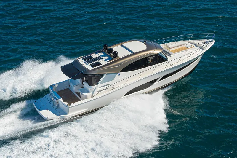Slide: The Image of Manufacturer Provided Image: 2025 Riviera 585 SUV cruising on open water, showcasing sleek design and powerful performance. - 34