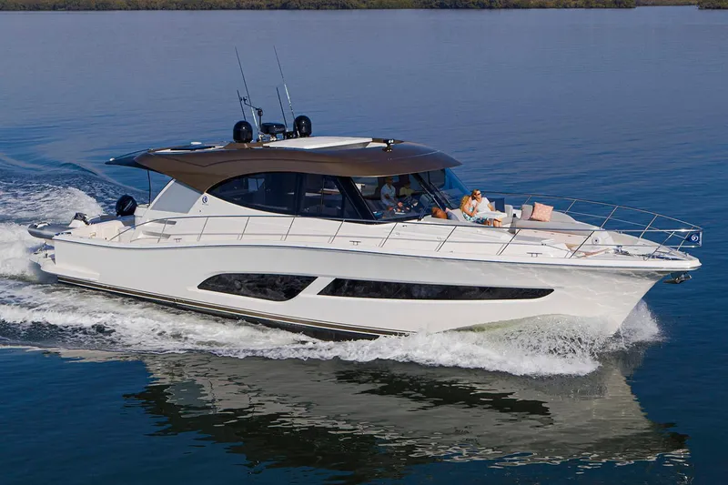 Slide: The Image of Manufacturer Provided Image: 2025 Riviera 585 SUV cruising on calm waters, showcasing sleek design and luxury features. - 39