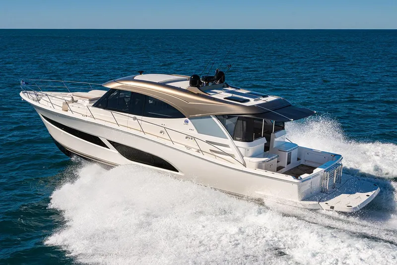 Slide: The Image of Manufacturer Provided Image: 2025 Riviera 585 SUV luxury yacht cruising on open water. - 40