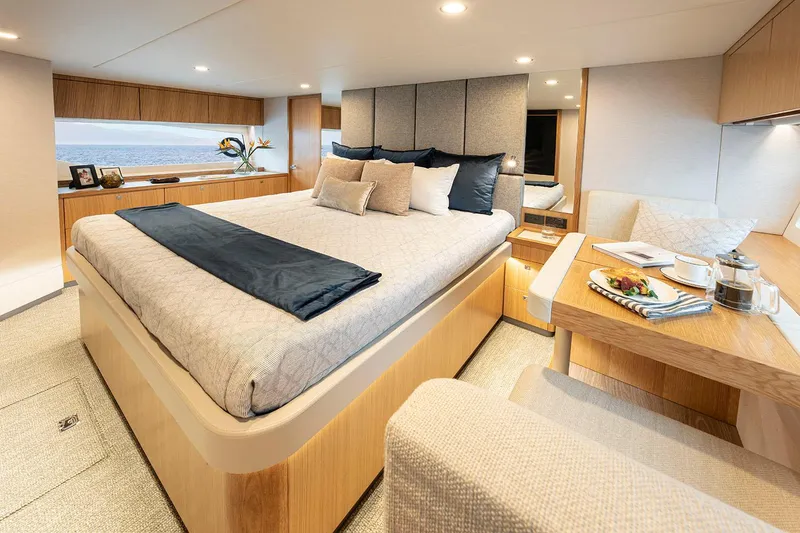Slide: The Image of Manufacturer Provided Image: Luxurious bedroom interior of 2025 Riviera 585 SUV yacht with modern design and ocean view. - 53