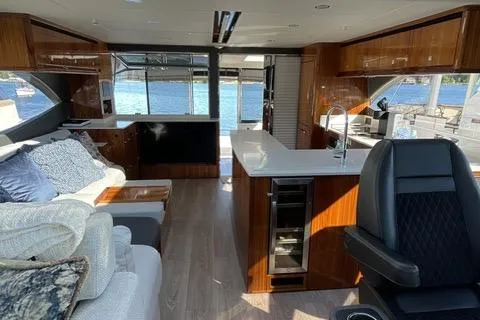 Slide: The Image of Luxurious interior of 2025 Riviera 585 SUV yacht with modern furnishings and scenic water views. - 6