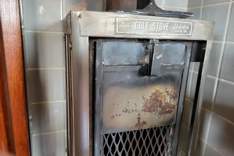 Slide: The Image of Vintage Cole Stove Model 1635 with rust, aboard 1976 Down East Yachts Cutter. - 19