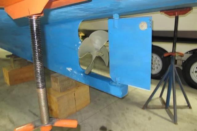 Slide: The Image of Engine compartment of a 2010 Ellis Downeast Picnic Boat, showcasing mechanical components. - 7