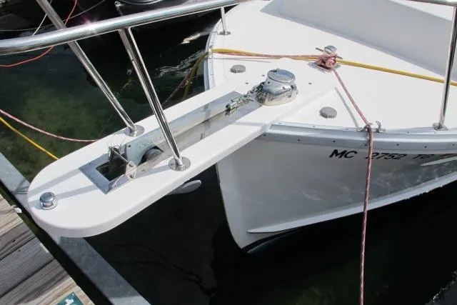 Slide: The Image of 2010 Ellis Downeast Picnic Boat hull on trailer, showcasing blue paint and drain hole. - 8