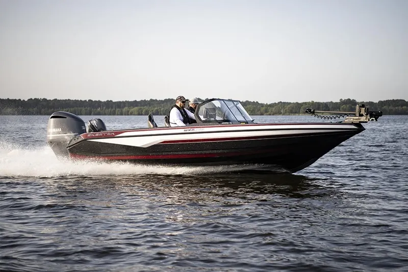 Slide: The Image of 2026 Skeeter WXR2060 boat interior with gray carpet and storage compartments. - 2