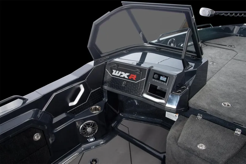 Slide: The Image of Manufacturer Provided Image: 2026 Skeeter WXR2060 boat cruising on a lake at sunset with two passengers. - 8