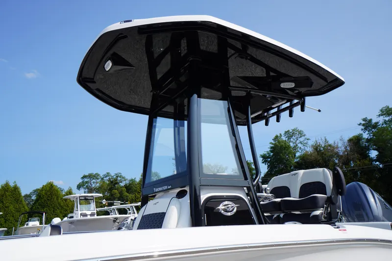 Slide: The Image of 2026 Tidewater 210 LXF boat with sleek design and modern features, under clear blue sky. - 12
