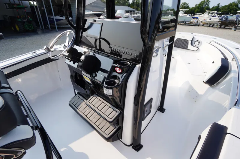 Slide: The Image of 2026 Tidewater 210 LXF boat interior with modern console and seating. - 15