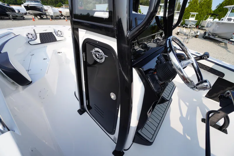 Slide: The Image of 2026 Tidewater 210 LXF boat interior with steering wheel and console details. - 20