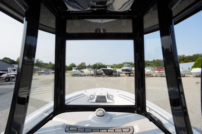Slide: The Image of 2026 Tidewater 210 LXF boat interior view at a marina. - 26
