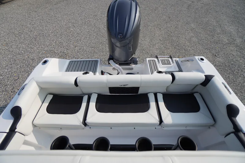 Slide: The Image of 2026 Tidewater 210 LXF boat interior with seating and engine view. - 34