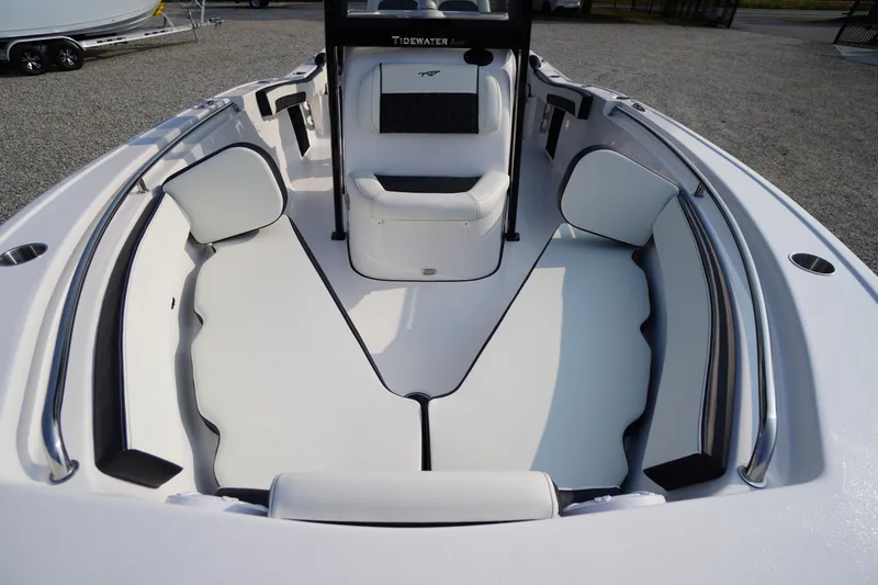 Slide: The Image of 2026 Tidewater 210 LXF boat interior with white cushioned seating and sleek design. - 4
