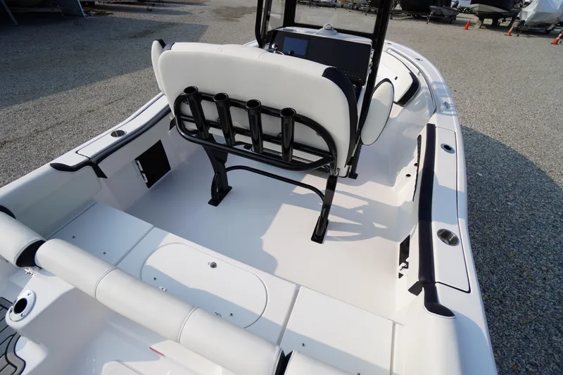 Slide: The Image of 2026 Tidewater 210 LXF boat interior with seating and rod holders, showcasing sleek design. - 41