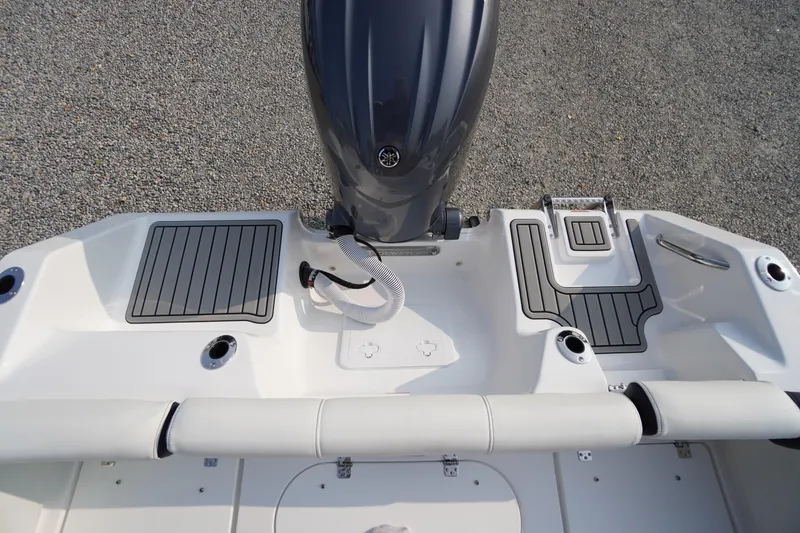 Slide: The Image of 2026 Tidewater 210 LXF boat deck with motor, featuring sleek design and modern fittings. - 45