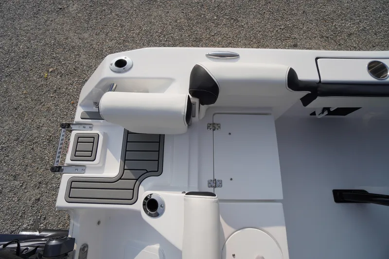 Slide: The Image of 2026 Tidewater 210 LXF boat interior with seating and storage compartments. - 47