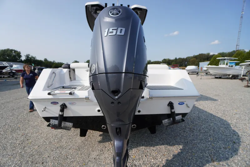 Slide: The Image of 2026 Tidewater 210 LXF boat with Yamaha 150 outboard engine, displayed outdoors. - 49