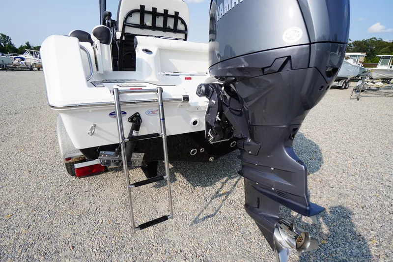 Slide: The Image of 2026 Tidewater 210 LXF boat with Yamaha outboard motor and boarding ladder. - 51