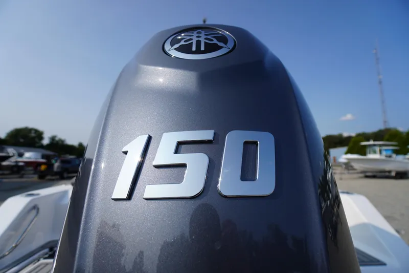 Slide: The Image of Close-up of a 2026 Tidewater 210 LXF boat engine with "150" marking. - 54