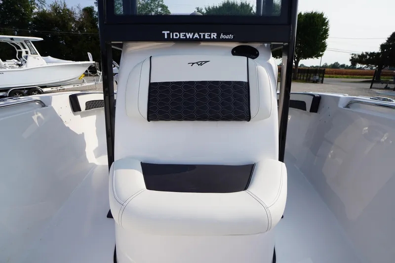 Slide: The Image of 2026 Tidewater 210 LXF boat interior with white and black seating. - 9