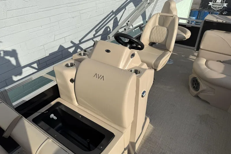 Slide: The Image of Interior of 2025 Avalon VTX Quad Fish boat with beige seating and steering console. - 4