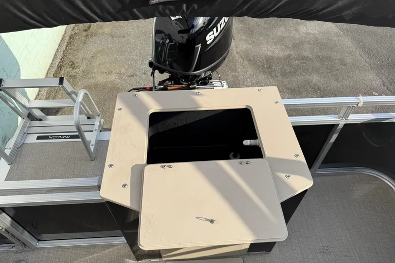 Slide: The Image of 2025 Avalon VTX Quad Fish boat with Suzuki outboard motor and rear deck view. - 6