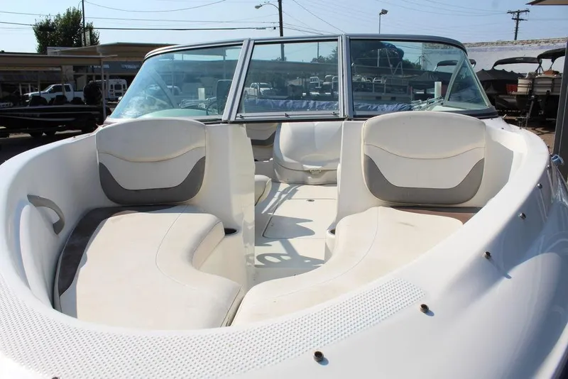 Slide: The Image of 2009 Bayliner 175 GT boat interior with white seating and windshield. - 12
