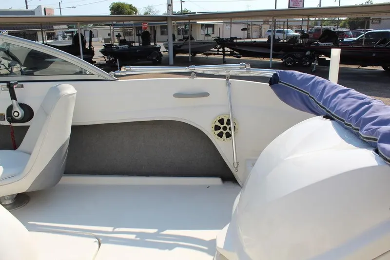 Slide: The Image of Interior of a 2009 Bayliner 175 GT boat, featuring seating and control panel. - 13