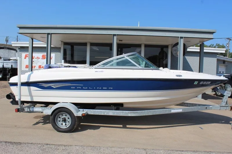 Slide: The Image of 2009 Bayliner 175 GT boat on trailer, parked outside a building. - 4
