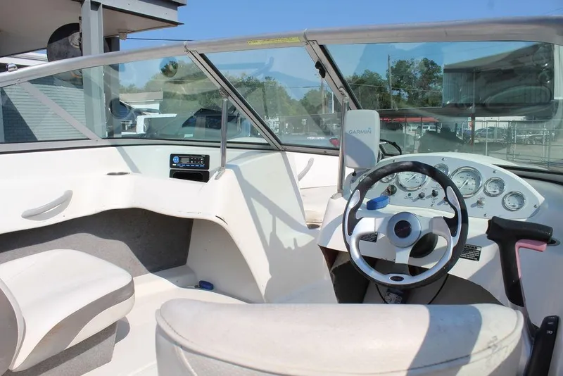 Slide: The Image of 2009 Bayliner 175 GT boat interior with steering wheel and dashboard controls. - 8