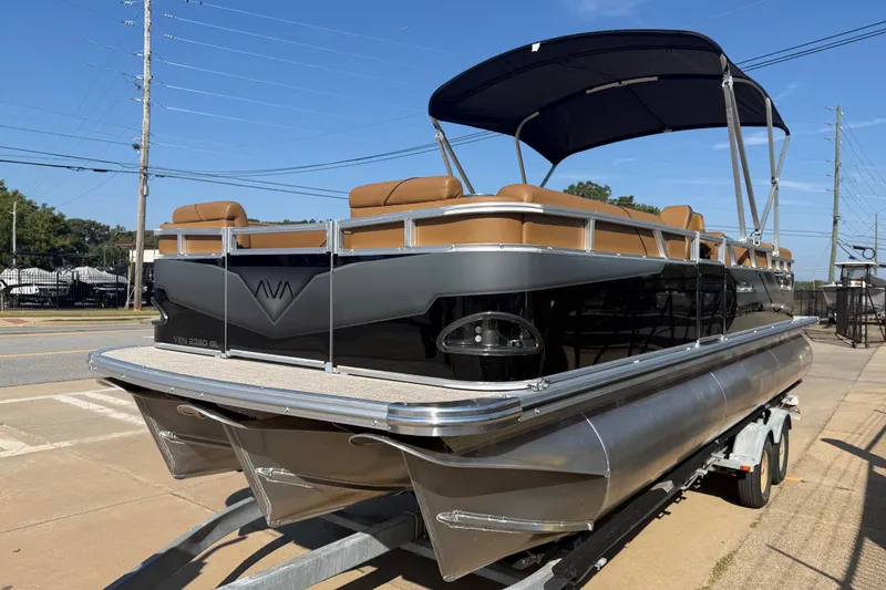 Slide: The Image of 2026 Avalon VENTURE QUAD LOUNGER pontoon boat on trailer, featuring sleek design and canopy. - 3