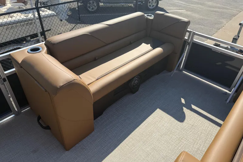 Slide: The Image of 2026 Avalon VENTURE QUAD LOUNGER with tan seating and cup holders on a boat deck. - 11