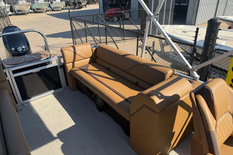 Slide: The Image of 2026 Avalon VENTURE QUAD LOUNGER boat interior with tan seating and modern design. - 13