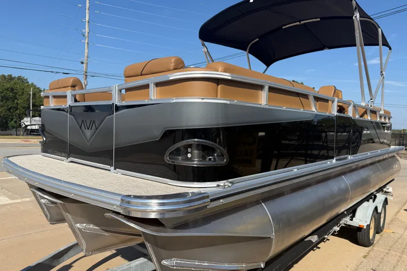 Slide: The Image of 2026 Avalon VENTURE QUAD LOUNGER pontoon boat with sleek design and tan seating. - 4