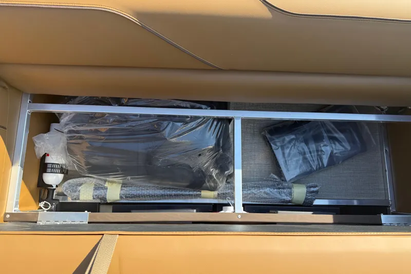 Slide: The Image of Storage compartment of 2026 Avalon Venture Quad Lounger, showcasing organized interior space. - 30