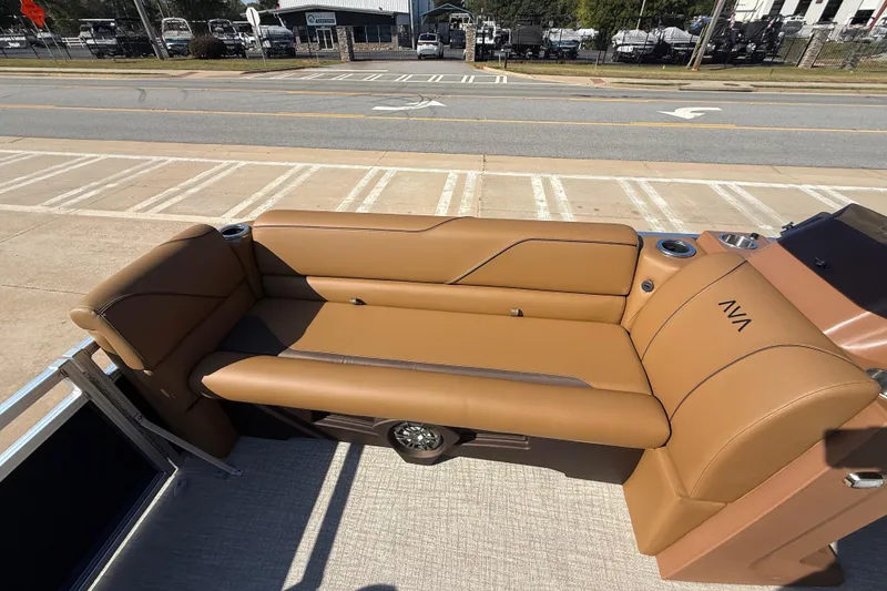 Slide: The Image of 2026 Avalon VENTURE QUAD LOUNGER with tan leather seating, cup holders, and modern design. - 31