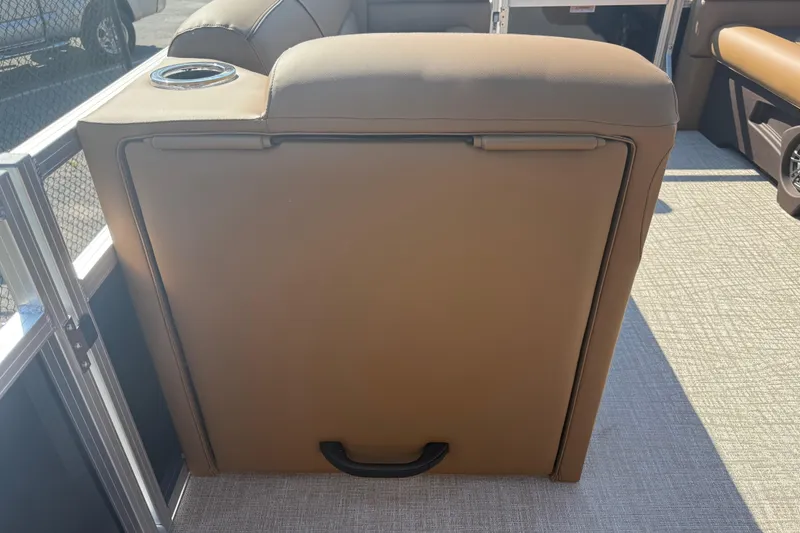 Slide: The Image of 2026 Avalon VENTURE QUAD LOUNGER interior with tan seating and cup holder. - 25