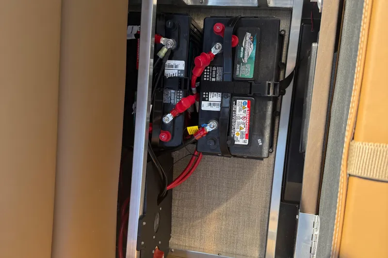 Slide: The Image of Battery compartment of 2026 Avalon VENTURE QUAD LOUNGER with Marine Master batteries. - 35