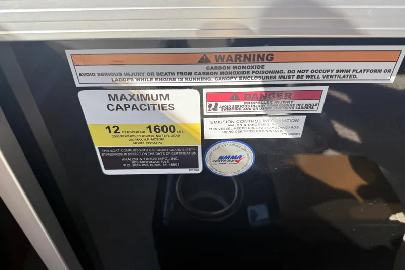 Slide: The Image of Warning and capacity labels on 2026 Avalon VENTURE QUAD LOUNGER boat. - 27